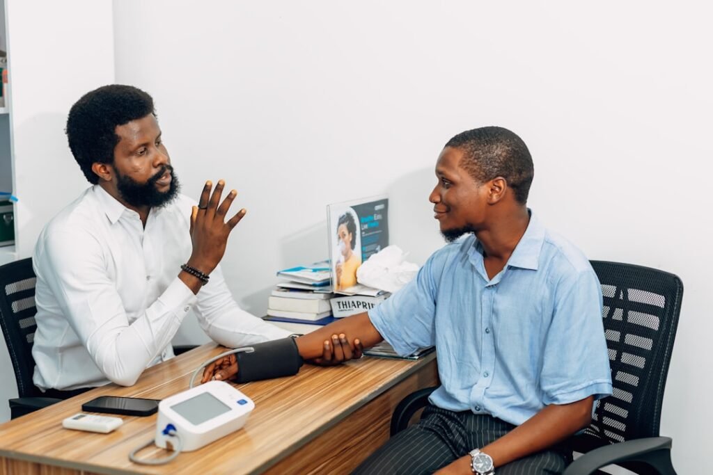 Man speaking with a doctor about gynecomastia in men