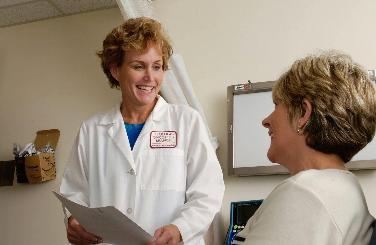 Female doctor discussing scan preparation with a female patient
